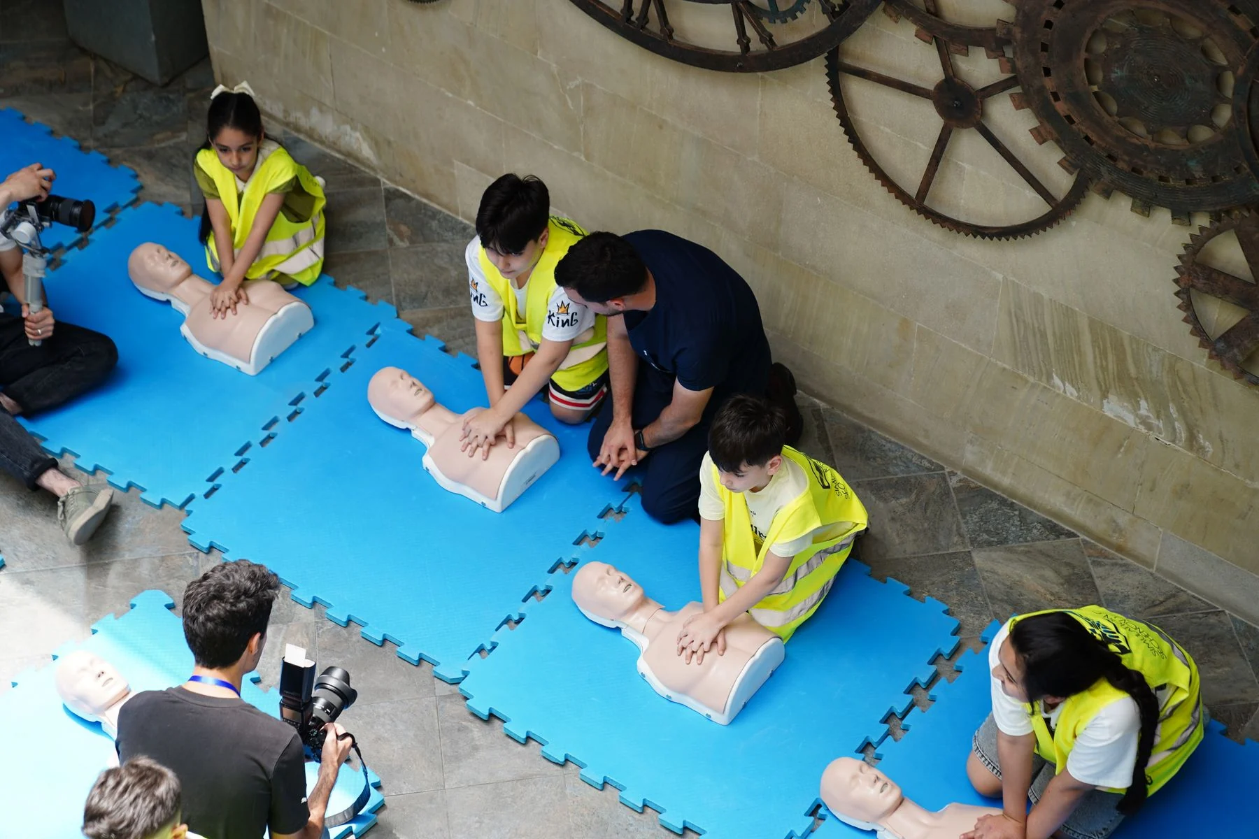Participants practising CPR during a group training workshop