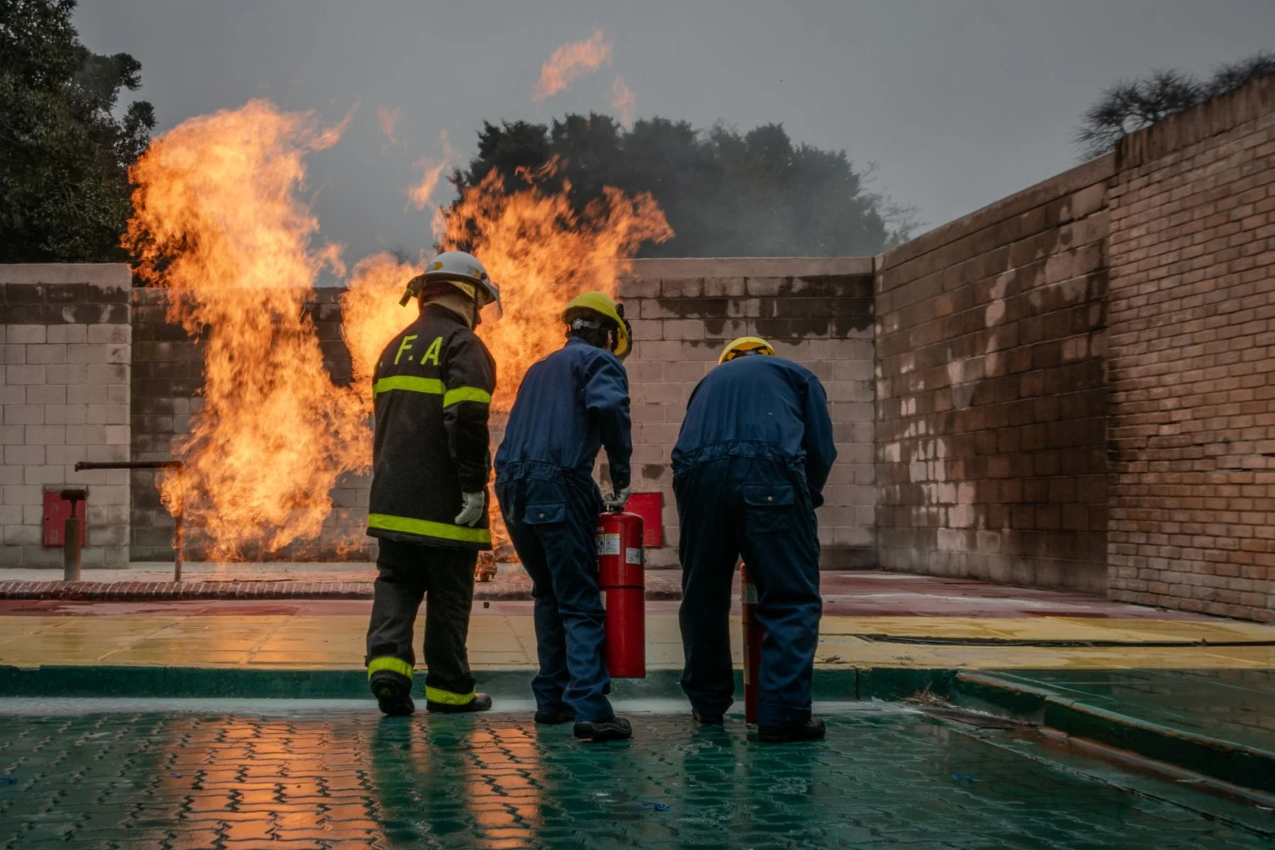 Firefighters practising a controlled fire safety exercise