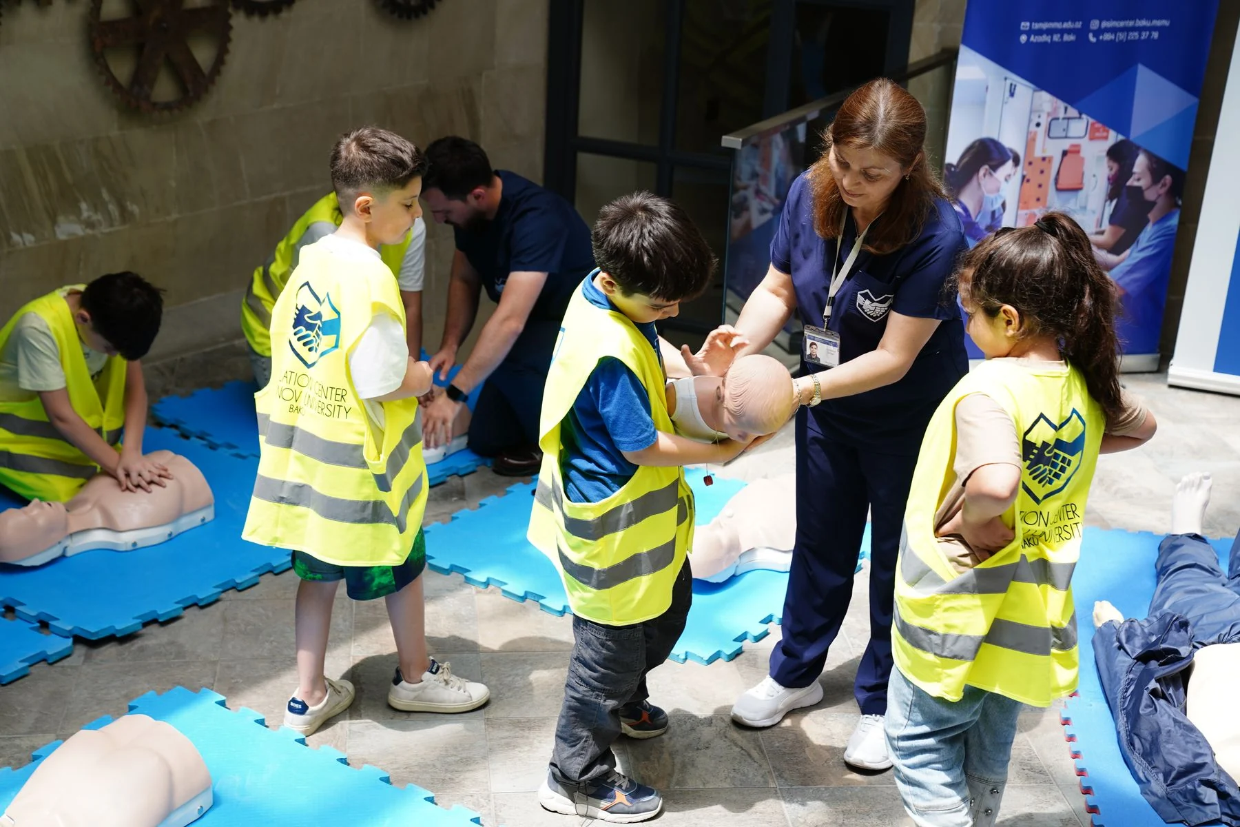 Instructor teaching CPR in a first aid workshop