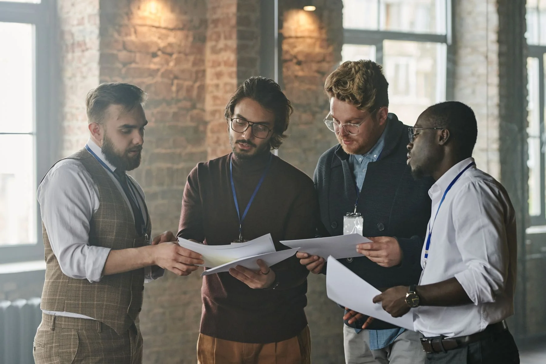 Colleagues reviewing plans in a workplace — illustrative photograph